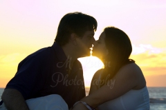 11_couple_engagement_kissing_beach